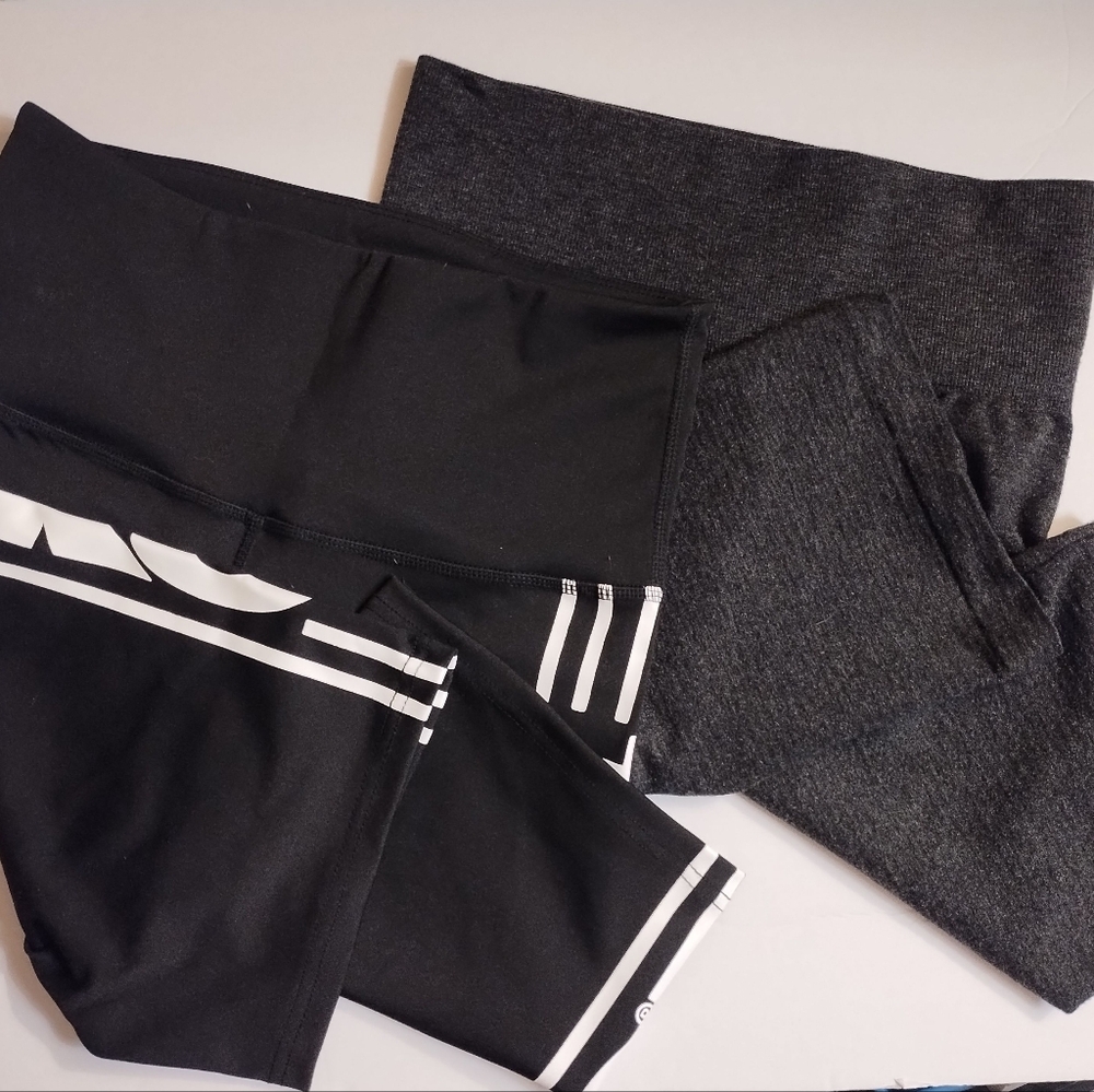 2 pair of athletic exercise shorts, TKO are black, Feathers ar dark brown size m